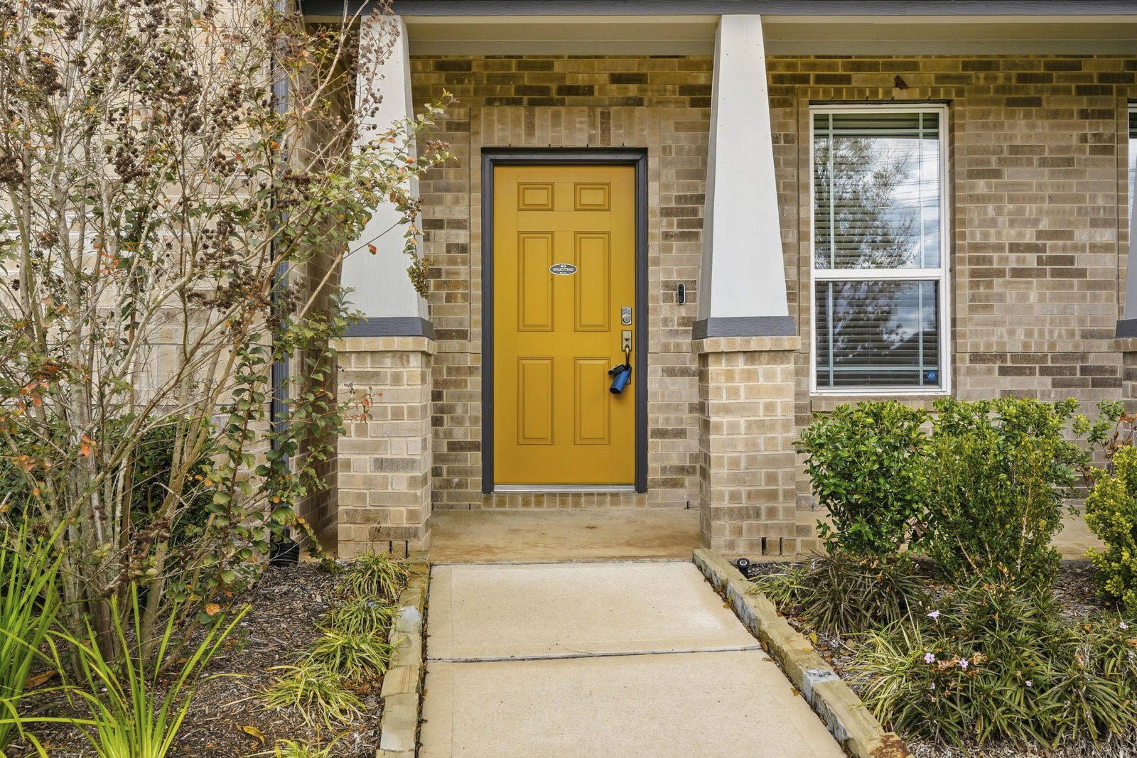 8038 Scanlan Trace Missouri City, TX 77459 - Photo 2 of 25 view of a brick house with a large window