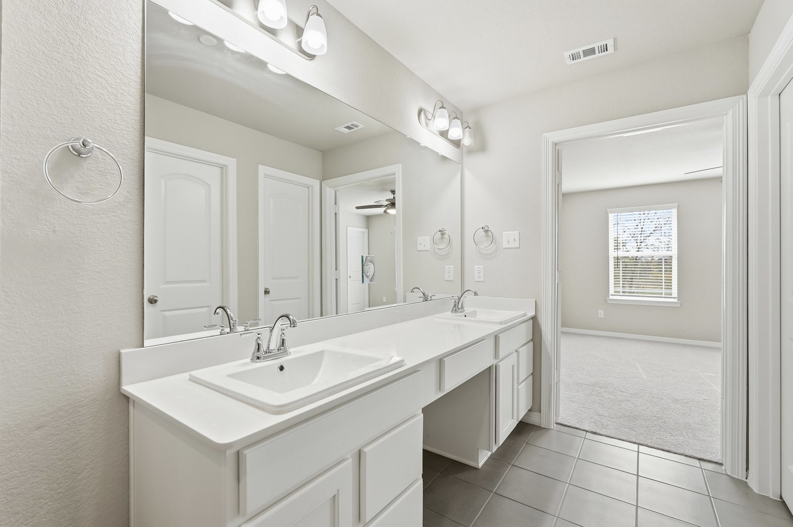 8038 Scanlan Trace Missouri City, TX 77459 - Photo 24 of 25 a bathroom with a sink double vanity and a mirror