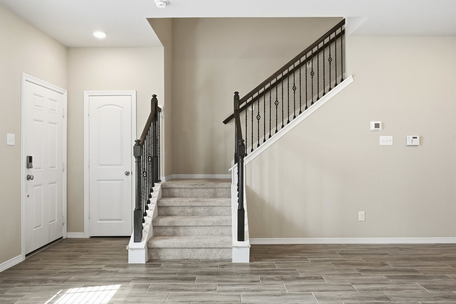 8038 Scanlan Trace Missouri City, TX 77459 - Photo 7 of 25 a view of entryway with wooden floor
