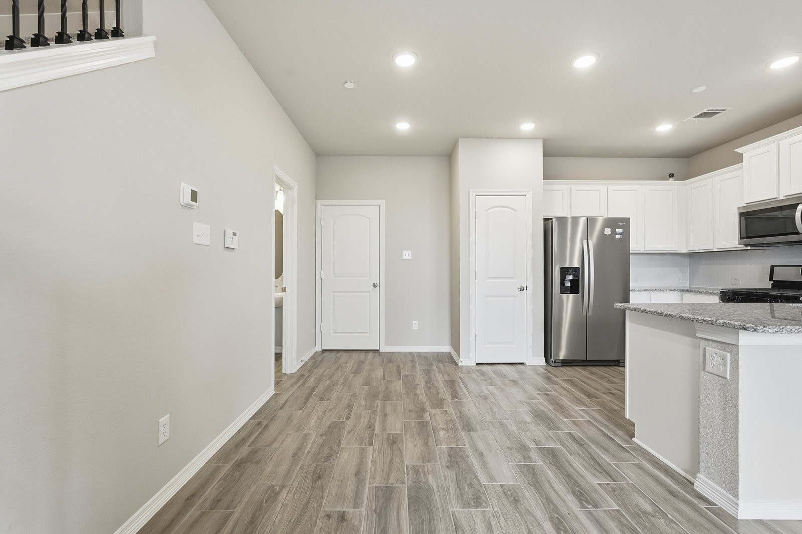 8038 Scanlan Trace Missouri City, TX 77459 - Photo 8 of 25 a view of a kitchen with a sink and a refrigerator