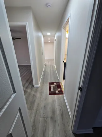 a view of entryway with wooden floor