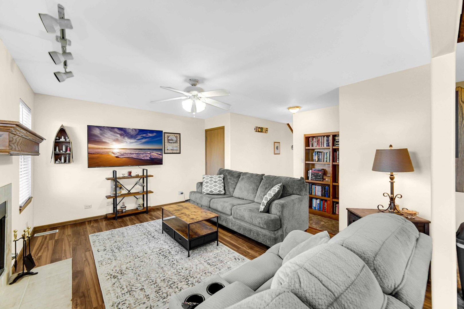 511 Davidson Drive, Unit B Minooka, IL 60447 - Photo 4 of 10 a living room with furniture and a flat screen tv