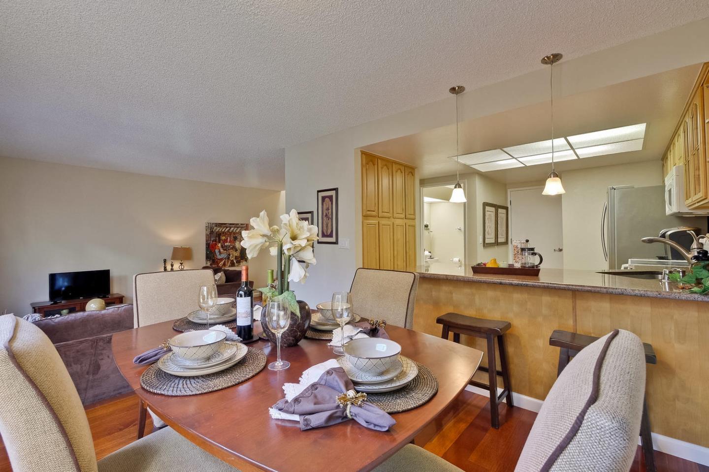 96 Redding Road Campbell, CA 95008 - Photo 12 of 52 a dining room with furniture and a wooden floor
