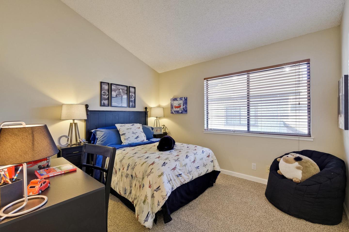 96 Redding Road Campbell, CA 95008 - Photo 33 of 52 a bedroom with two beds and a couch next to a window