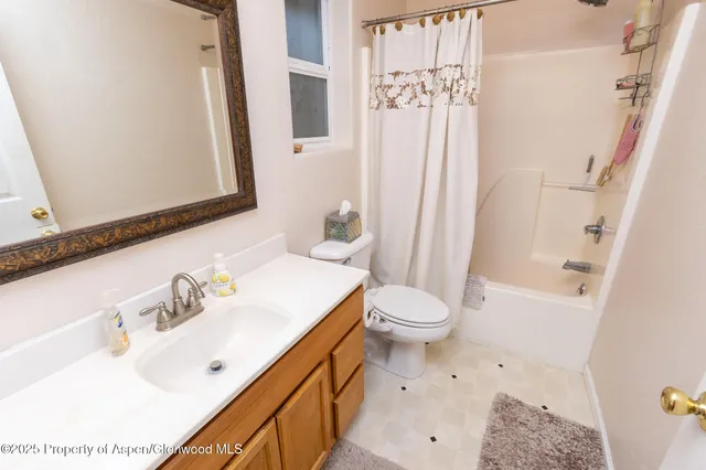 a bathroom with a bathtub and shower