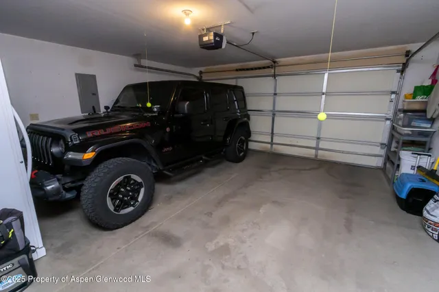 a view of a patio with a table and chairs