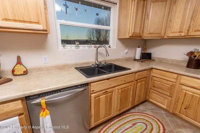 a bed room with a bed and a television