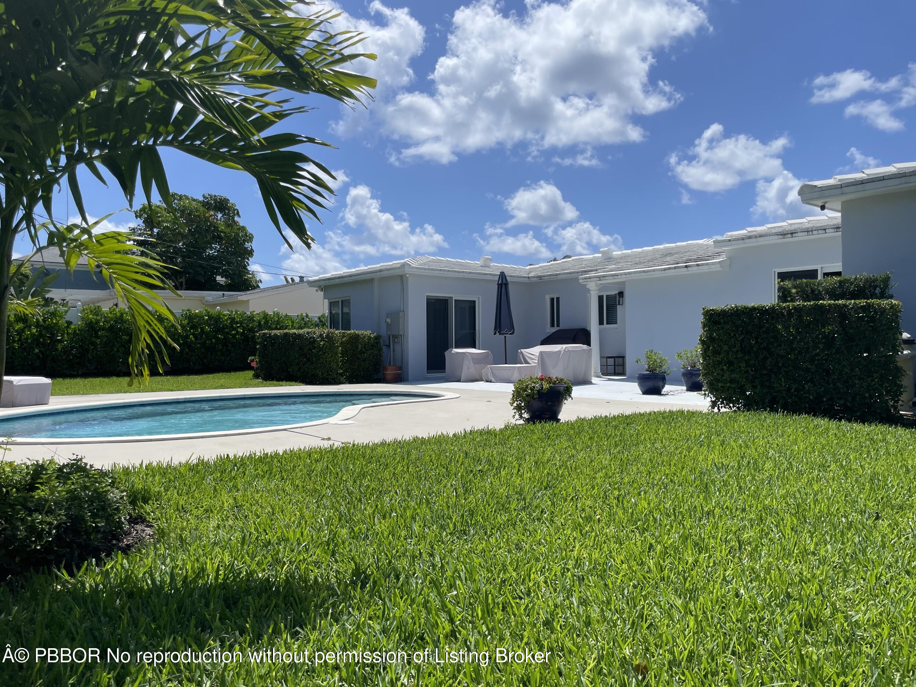 369 Valley Forge Road West Palm Beach, FL 33405 - Photo 4 of 19 a view of a house with a patio