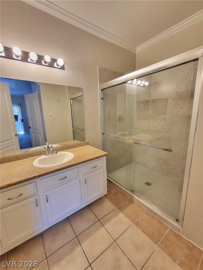 5525 West Flamingo Road, Unit 2040 Las Vegas, NV 89103 - Photo 12 of 15 A well-appointed bathroom with a spacious walk-in shower and a vanity featuring ample counter space.