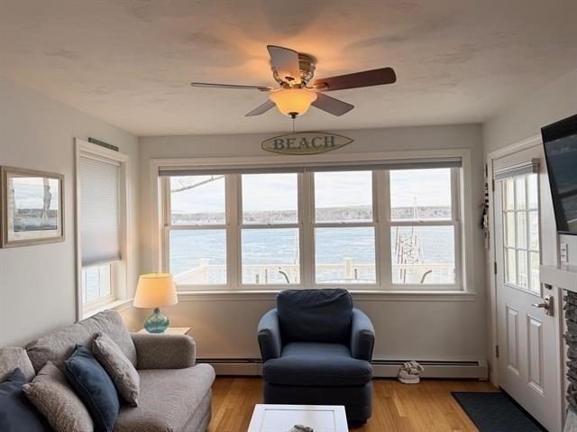144 Lake Street, Unit 11 Laconia, NH 03246 - Photo 14 of 38 a living room with furniture and a window