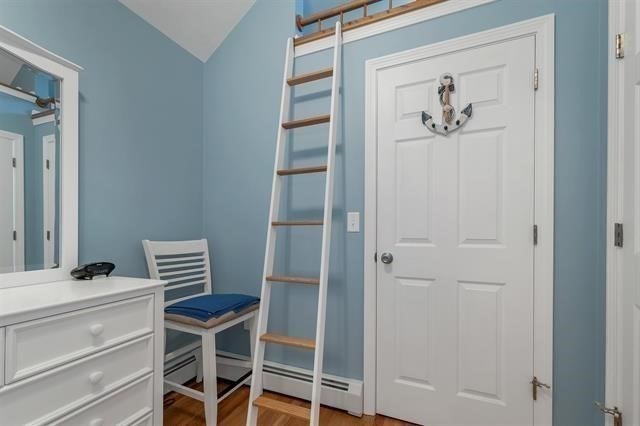 144 Lake Street, Unit 11 Laconia, NH 03246 - Photo 21 of 38 a bathroom with a window and a painting on the wall