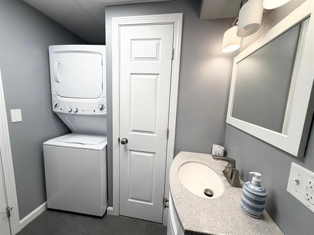 144 Lake Street, Unit 11 Laconia, NH 03246 - Photo 31 of 38 a bathroom with a toilet and a sink