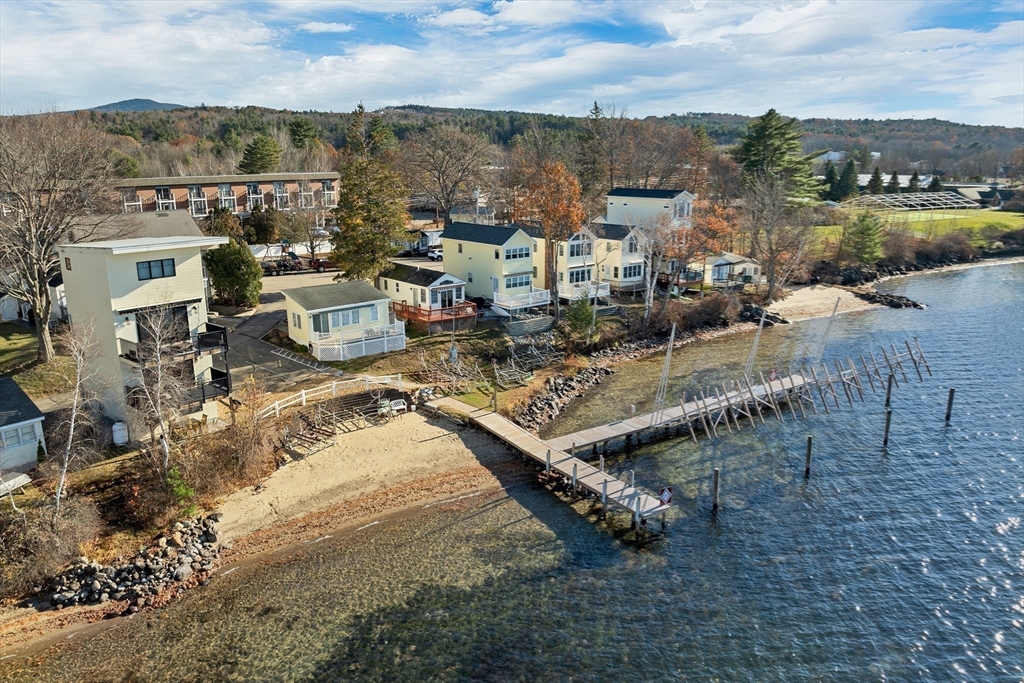 144 Lake Street, Unit 11 Laconia, NH 03246 - Photo 36 of 38 an aerial view of a house with a lake view
