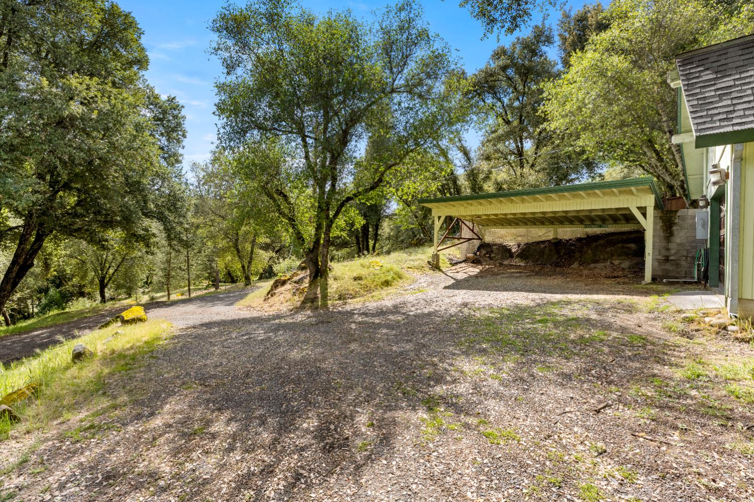 7321 Morning Canyon Road Placerville, CA 95667 - Photo 34 of 39 a view of backyard with wooden fence and a large tree