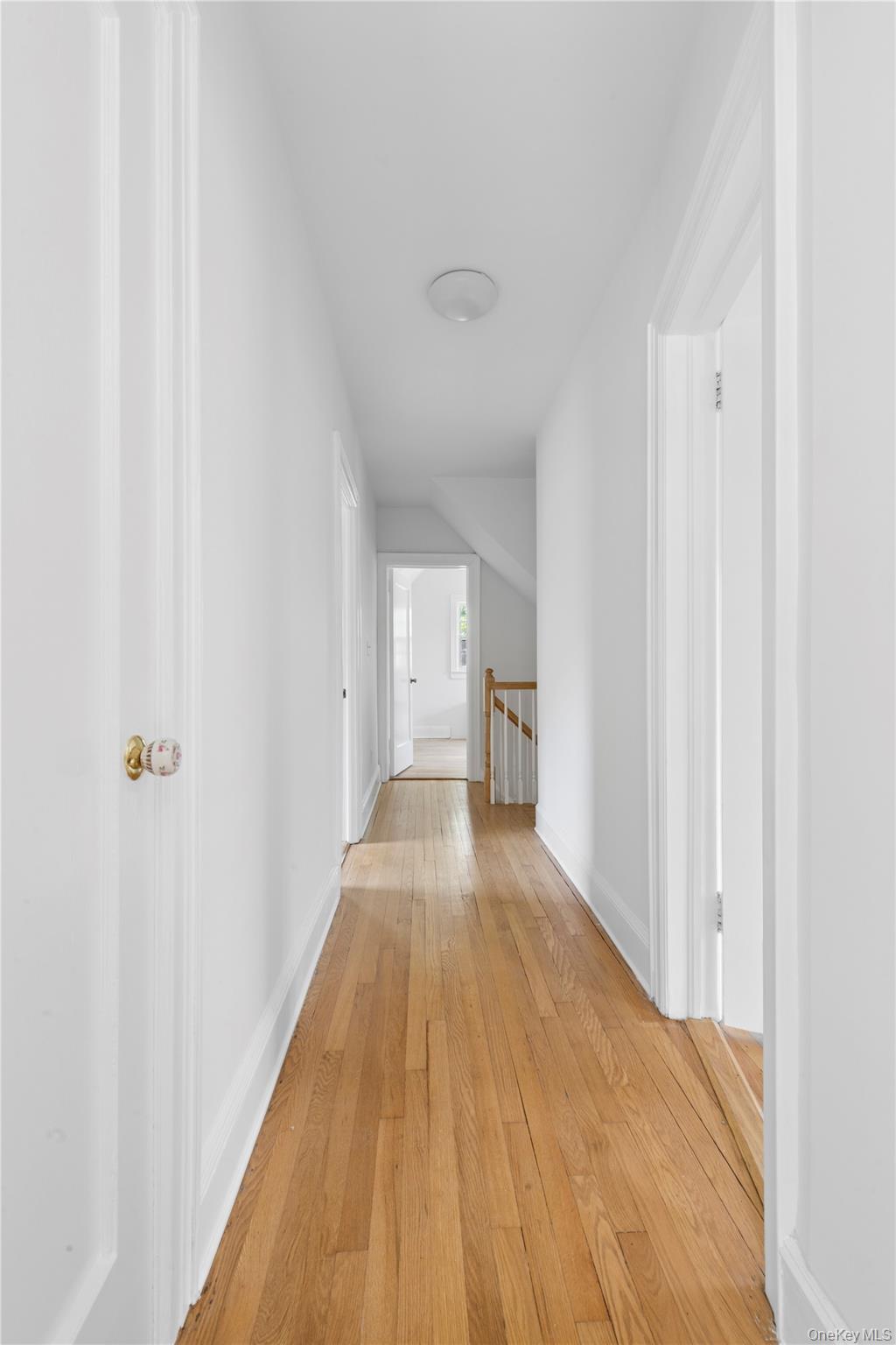 17 Old Orchard Road New Rochelle, NY 10804 - Photo 11 of 32 a view of a hallway with wooden floor