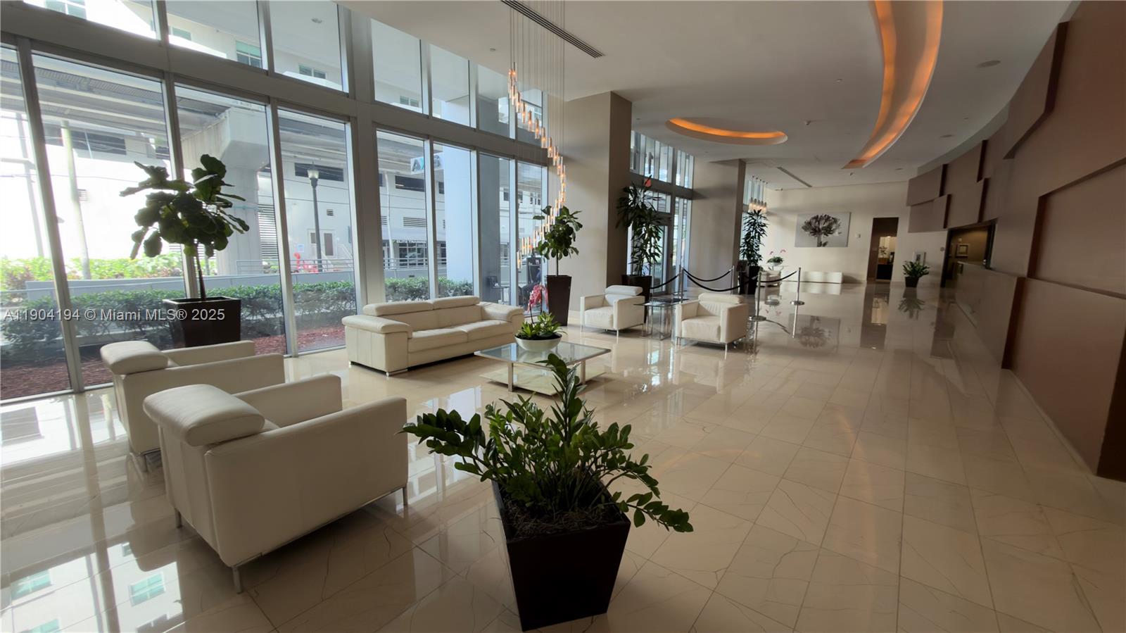 1111 Southwest 1st Avenue, Unit 2516N Miami, FL 33130 - Photo 18 of 31 a living room with furniture and a large window