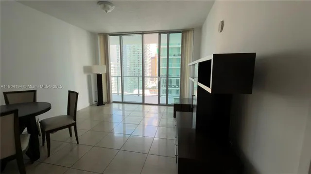 a room with a bed table and window