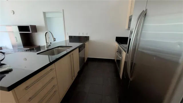 a kitchen with a stove and cabinets