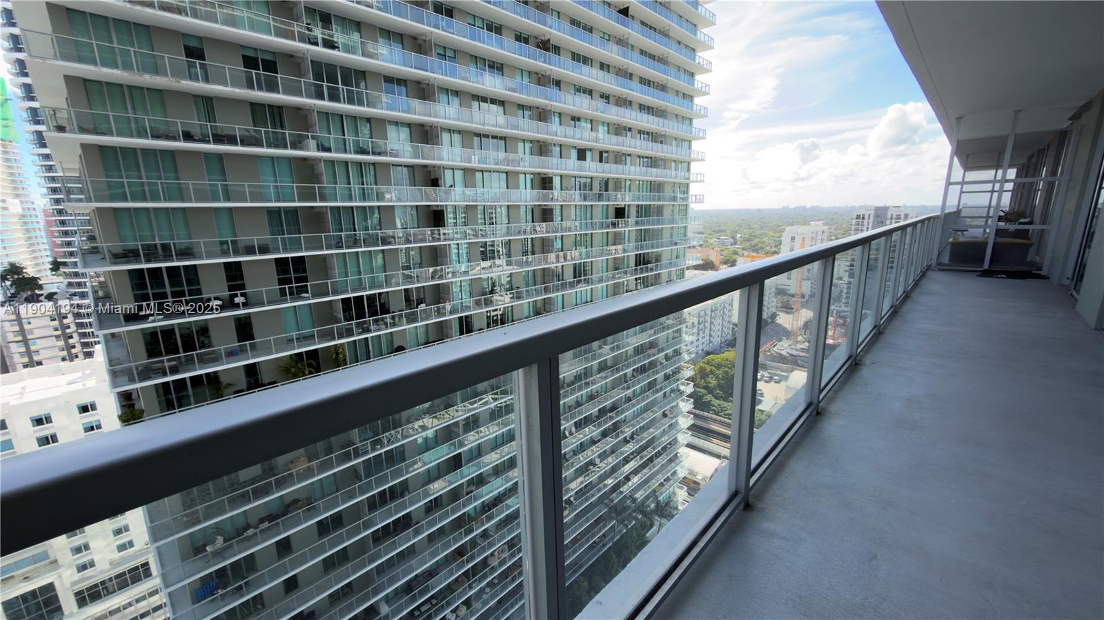 1111 Southwest 1st Avenue, Unit 2516N Miami, FL 33130 - Photo 31 of 31 a view of balcony with wooden floor and windows