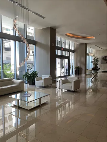 a lobby with a stove and a window