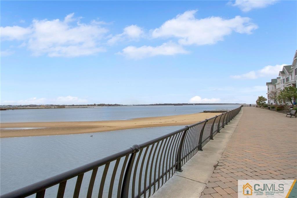 21 Raritan Reach Road, Unit 11 South Amboy, NJ 08879 - Photo 2 of 28 a balcony with an ocean view