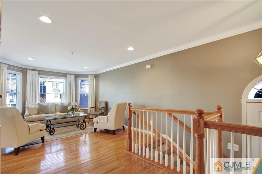 21 Raritan Reach Road, Unit 11 South Amboy, NJ 08879 - Photo 12 of 28 a living room with furniture and a wooden floor
