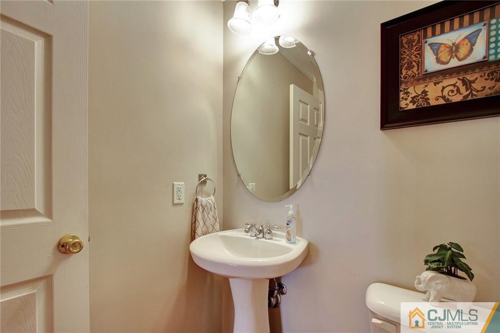 21 Raritan Reach Road, Unit 11 South Amboy, NJ 08879 - Photo 13 of 28 a bathroom with a sink and a mirror