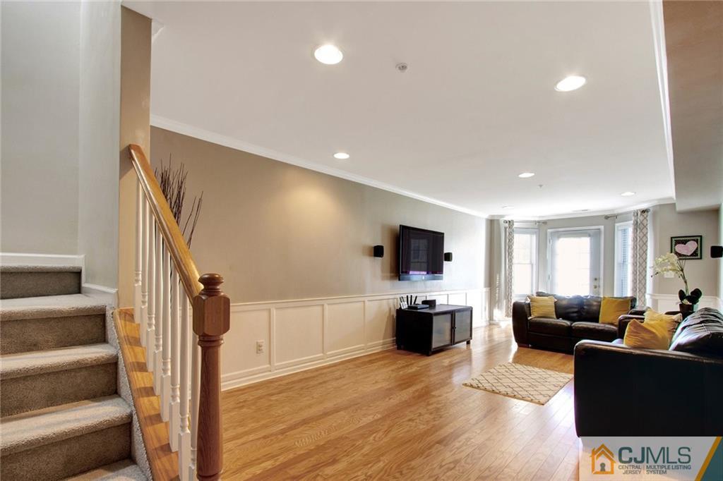 21 Raritan Reach Road, Unit 11 South Amboy, NJ 08879 - Photo 14 of 28 a living room with furniture and a flat screen tv