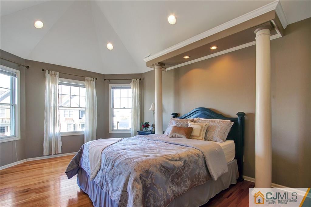 21 Raritan Reach Road, Unit 11 South Amboy, NJ 08879 - Photo 17 of 28 a bedroom with a large bed and a window