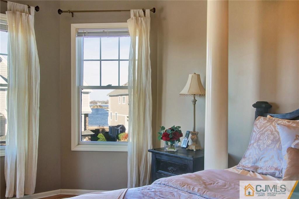21 Raritan Reach Road, Unit 11 South Amboy, NJ 08879 - Photo 18 of 28 a bedroom with a bed and a window