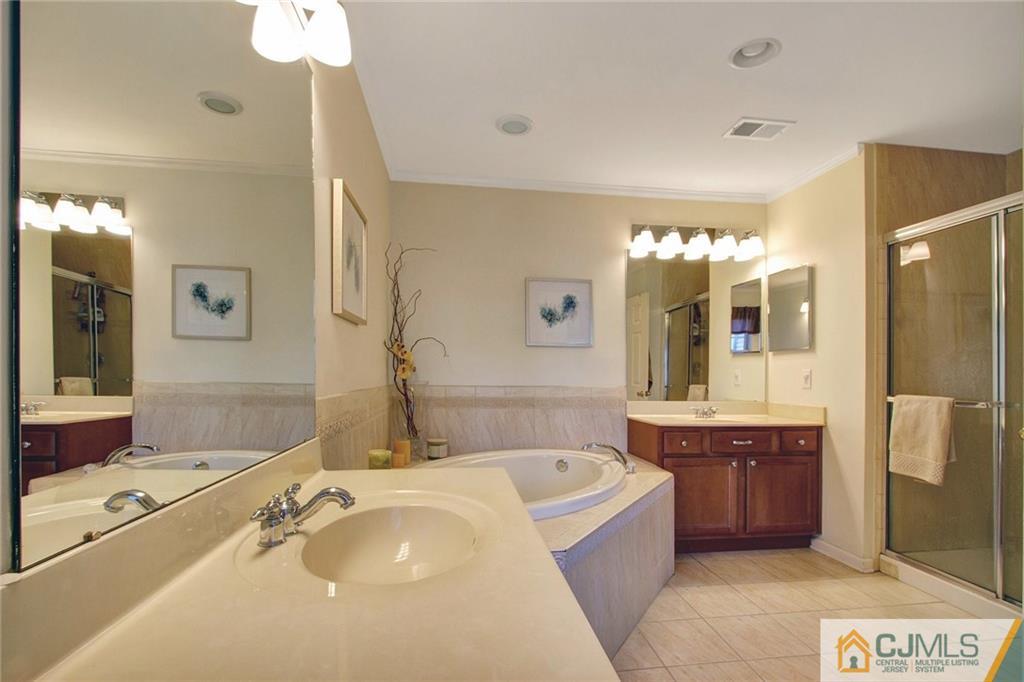21 Raritan Reach Road, Unit 11 South Amboy, NJ 08879 - Photo 19 of 28 a spacious bathroom with a tub sink and mirror