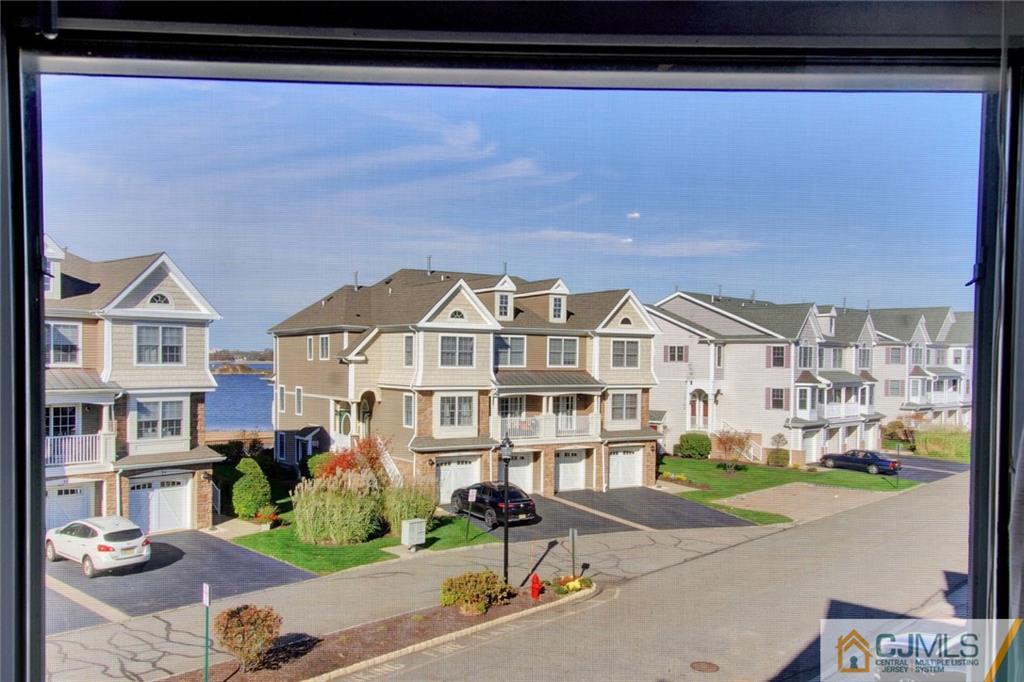 21 Raritan Reach Road, Unit 11 South Amboy, NJ 08879 - Photo 20 of 28 a front view of a building with street view