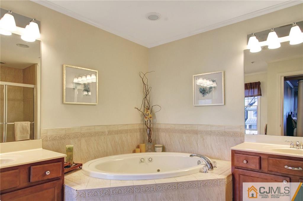 21 Raritan Reach Road, Unit 11 South Amboy, NJ 08879 - Photo 21 of 28 a bathroom with a bathtub and a sink