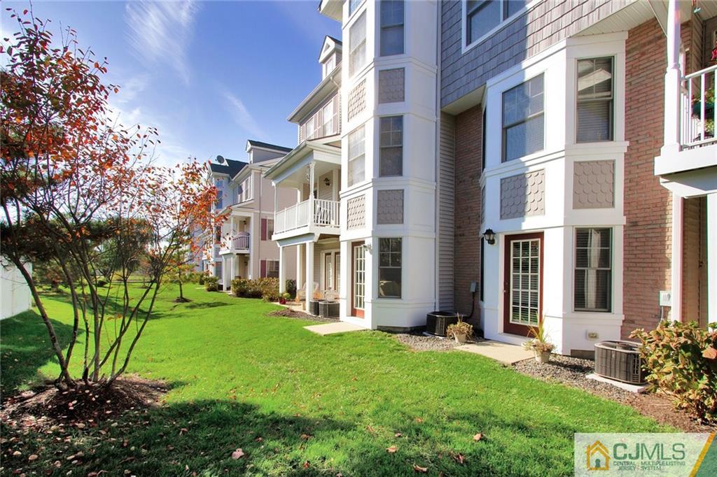 21 Raritan Reach Road, Unit 11 South Amboy, NJ 08879 - Photo 24 of 28 a view of a building with a yard