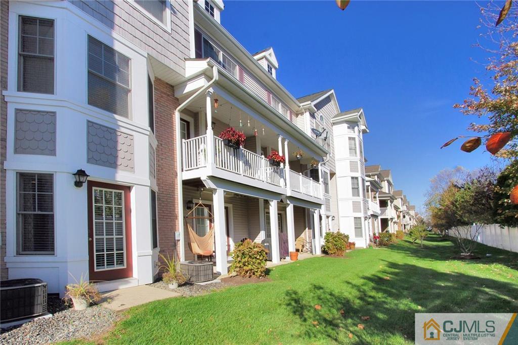 21 Raritan Reach Road, Unit 11 South Amboy, NJ 08879 - Photo 25 of 28 a view of a building with a yard