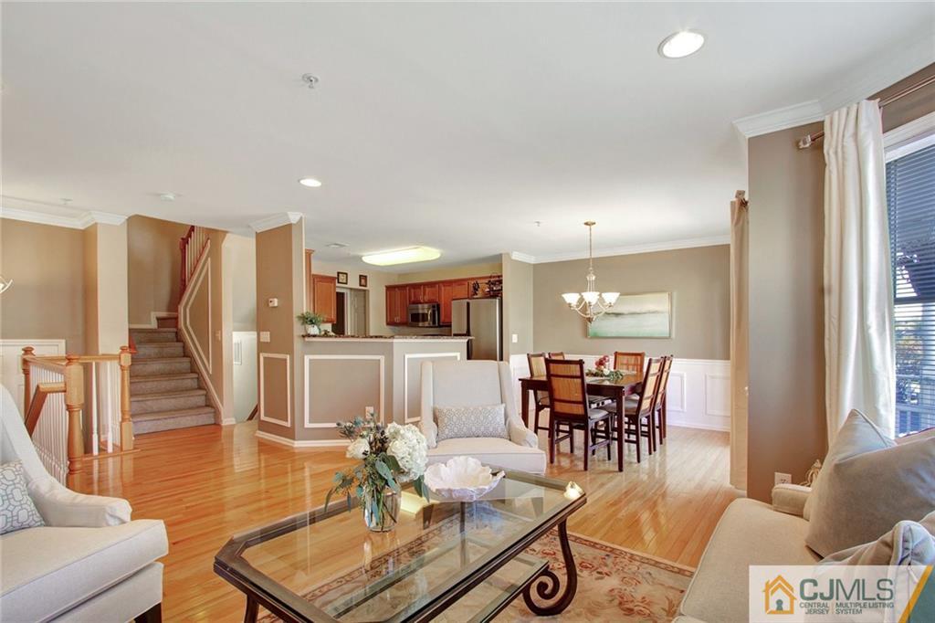 21 Raritan Reach Road, Unit 11 South Amboy, NJ 08879 - Photo 6 of 28 a living room with furniture a dining table and a window