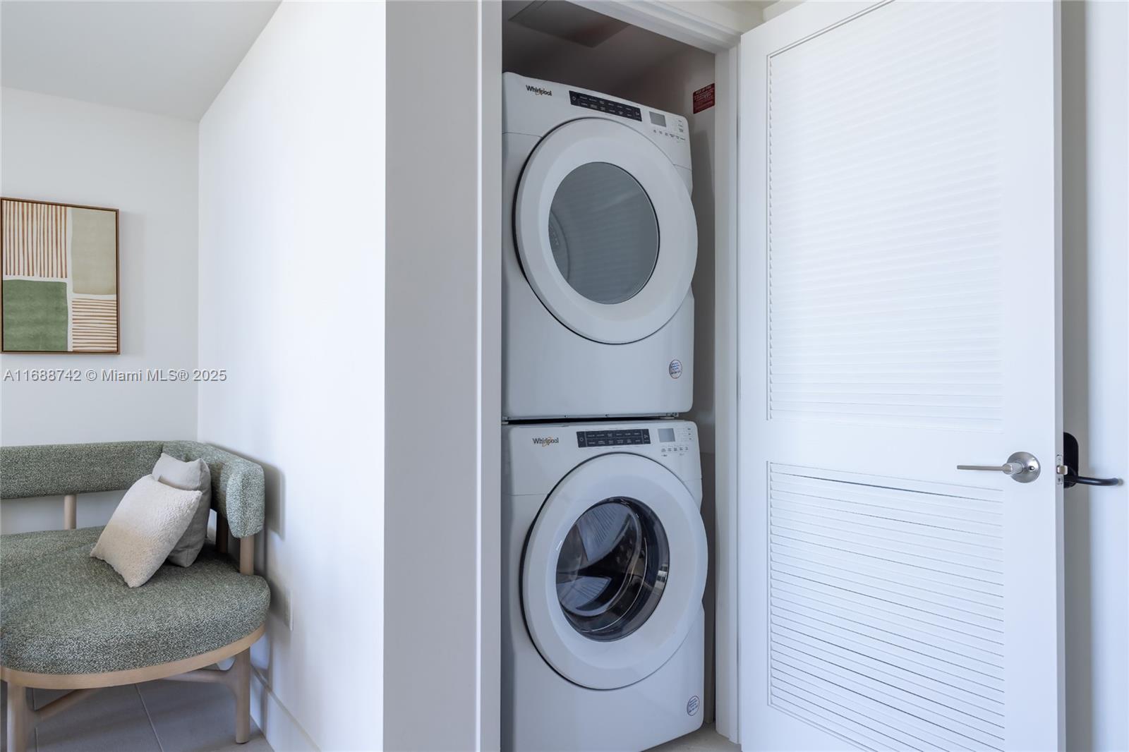 159 Northeast 6th Street, Unit 3013 Miami, FL 33132 - Photo 15 of 53 a close view of a utility room with dryer and washer