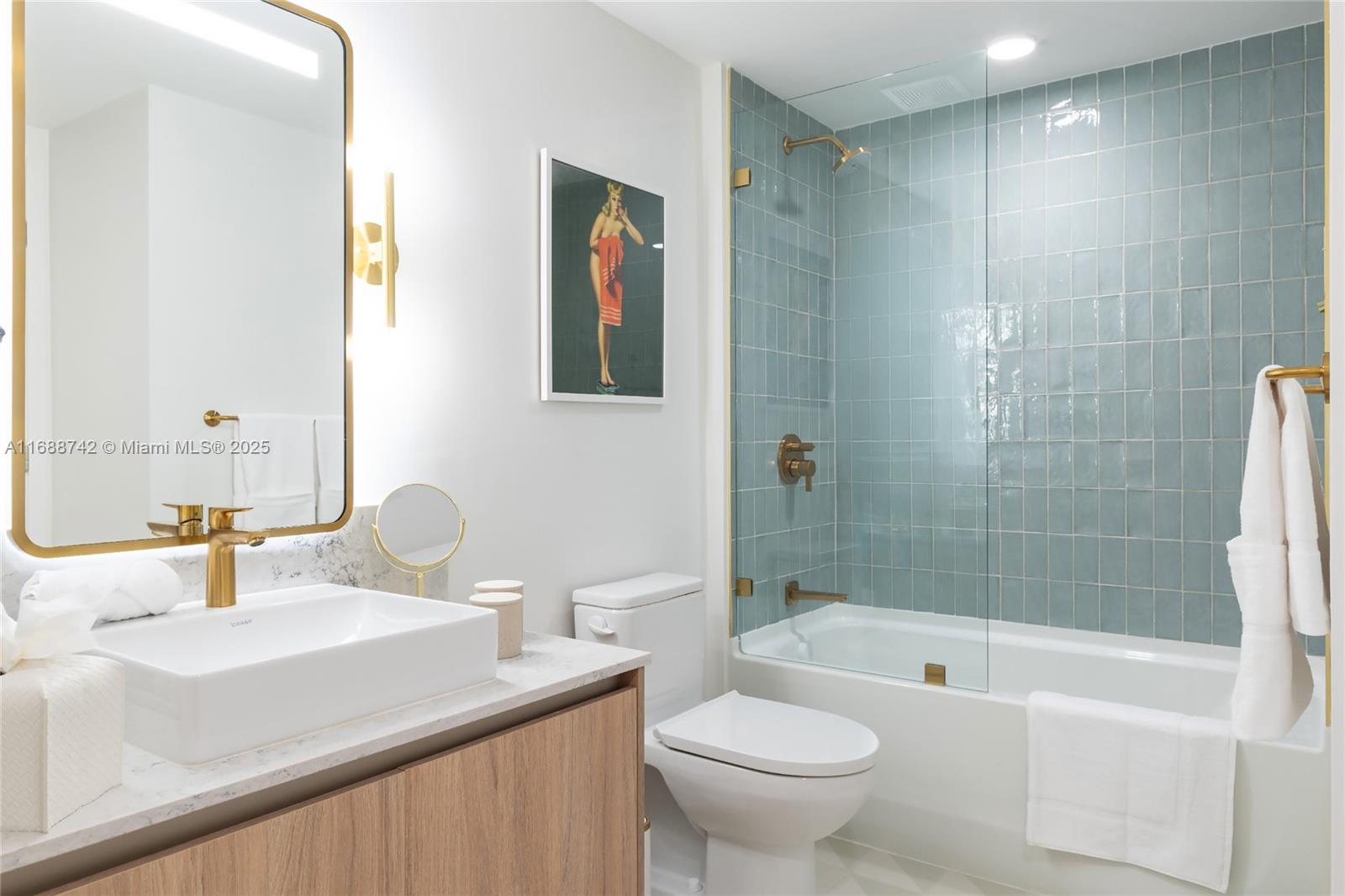 159 Northeast 6th Street, Unit 3013 Miami, FL 33132 - Photo 18 of 53 a bathroom with a sink mirror toilet and bathtub