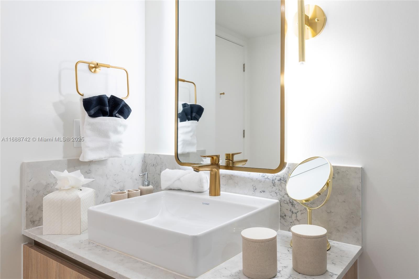 159 Northeast 6th Street, Unit 3013 Miami, FL 33132 - Photo 20 of 53 a bathroom with a toilet sink and mirror