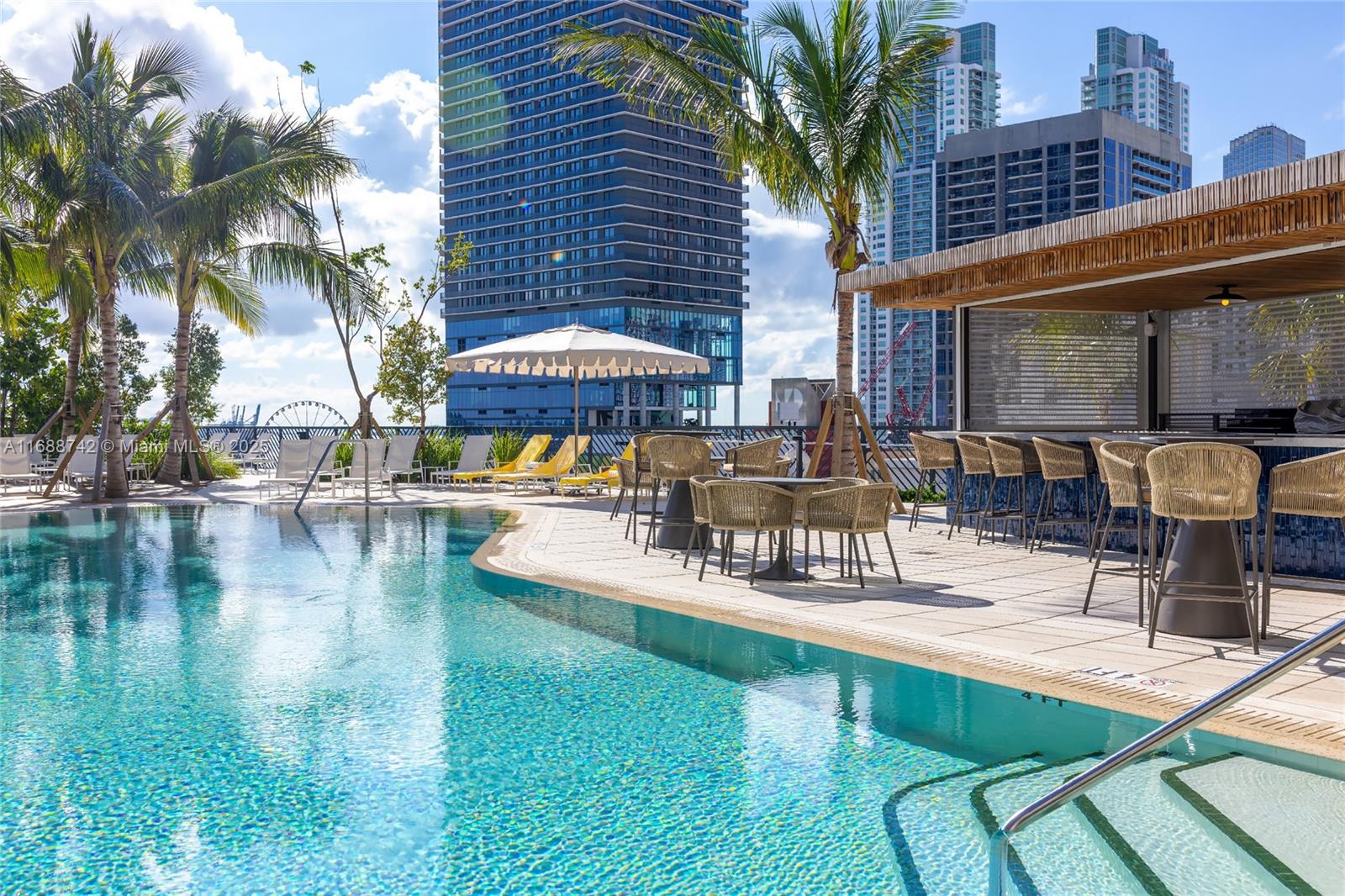 159 Northeast 6th Street, Unit 3013 Miami, FL 33132 - Photo 34 of 53 a swimming pool with outdoor seating and yard