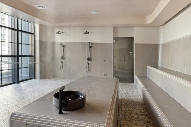 a bathroom with a sink a mirror and a window