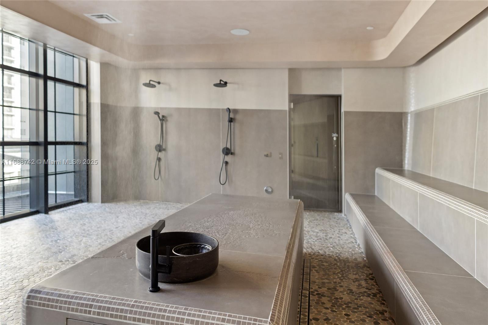 159 Northeast 6th Street, Unit 3013 Miami, FL 33132 - Photo 47 of 53 a bathroom with a tub and a shower