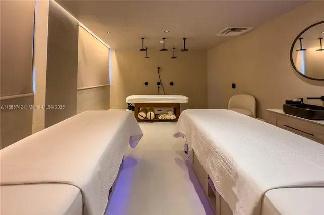 a bedroom with a bed and a chair