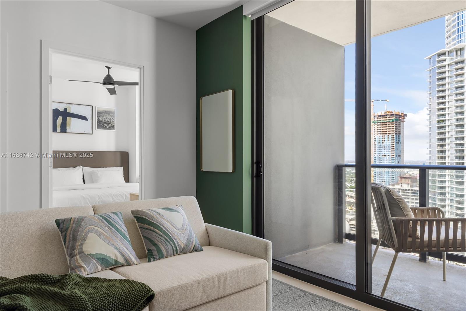 159 Northeast 6th Street, Unit 3013 Miami, FL 33132 - Photo 5 of 53 a living room with furniture and a window