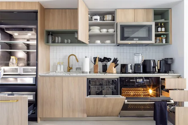 a kitchen with appliances and cabinets