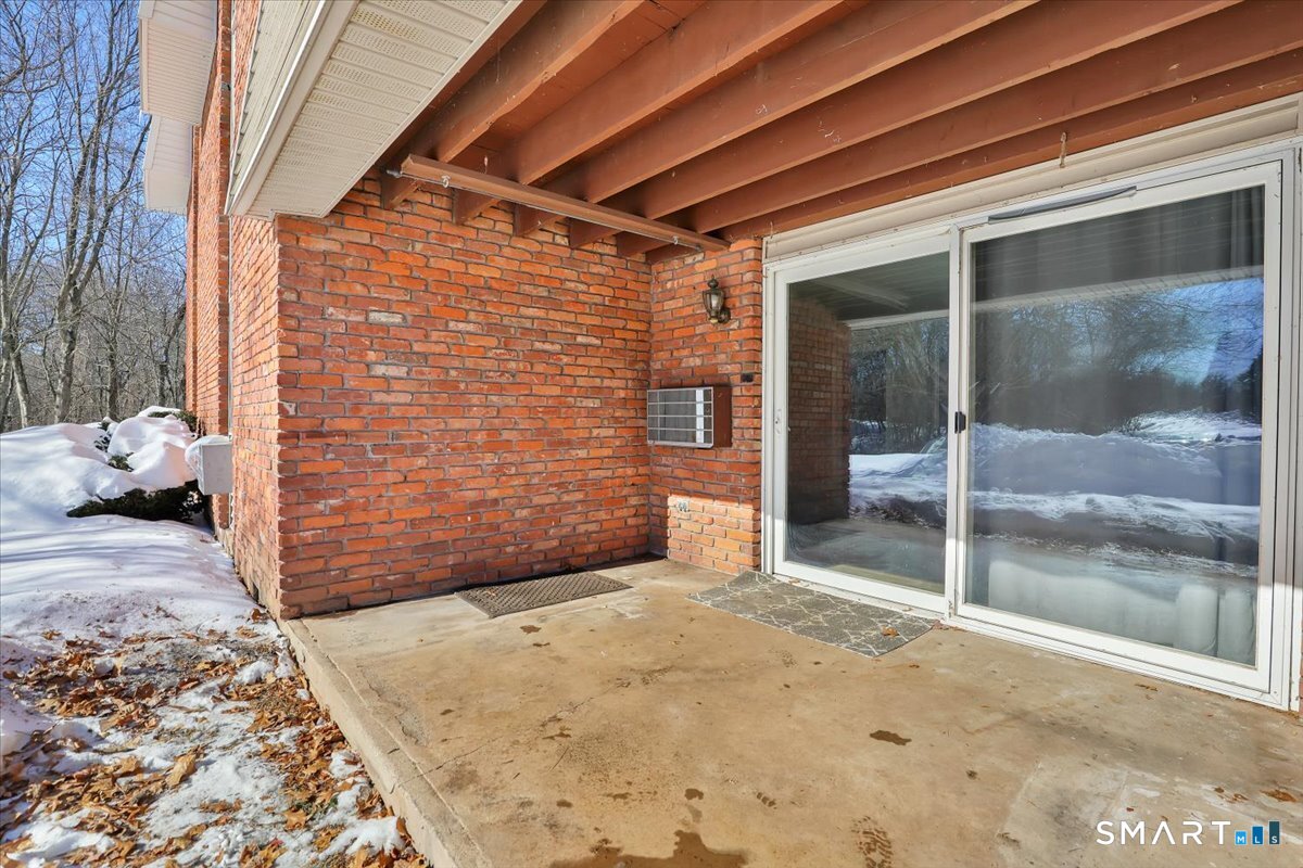 565 Talcottville Road, Unit 1A1 Vernon, CT 06066 - Photo 23 of 27 a view of backyard with sliding door