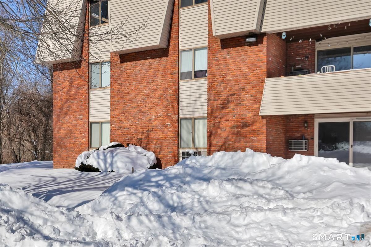 565 Talcottville Road, Unit 1A1 Vernon, CT 06066 - Photo 26 of 27 a view of a house with a yard