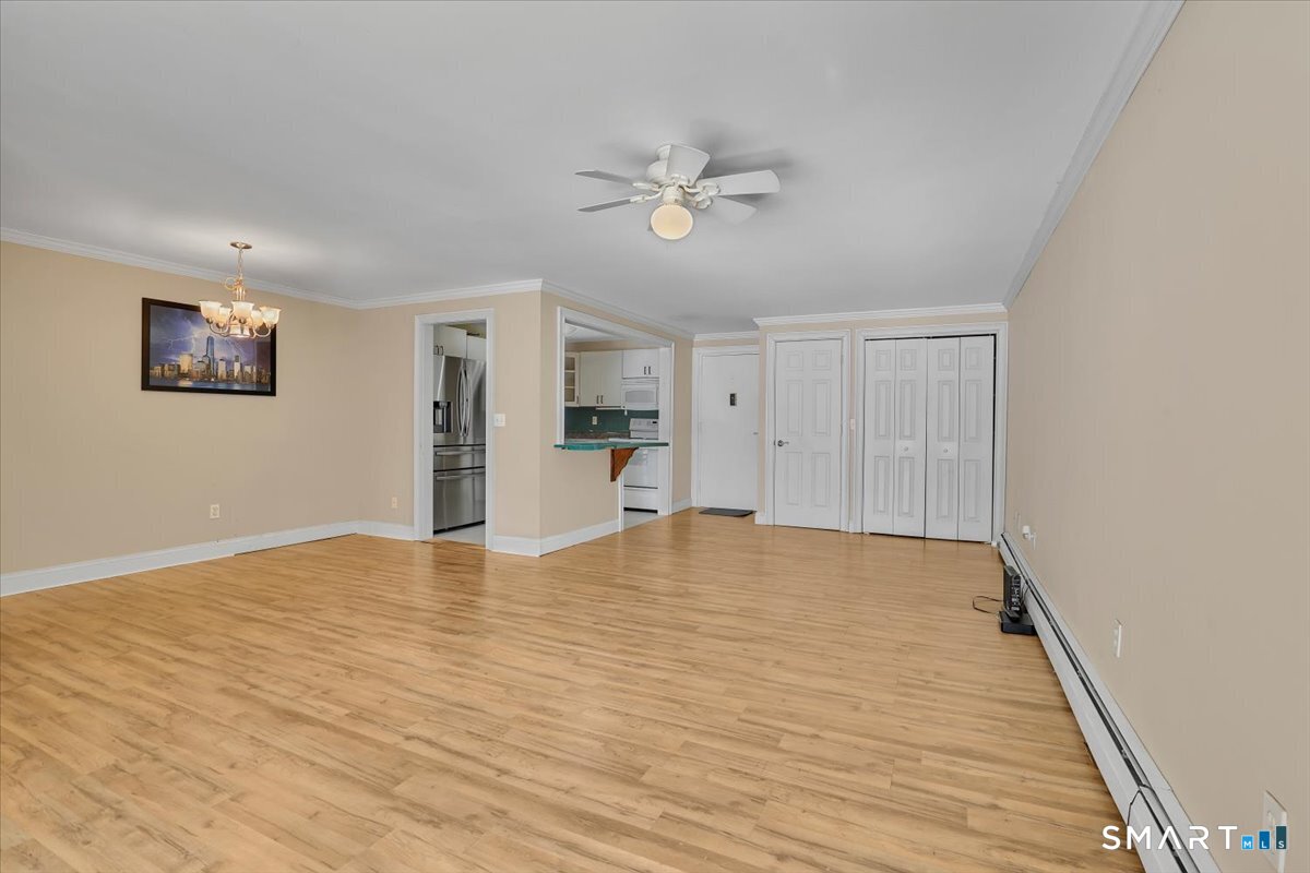 565 Talcottville Road, Unit 1A1 Vernon, CT 06066 - Photo 4 of 27 a view of empty room with wooden floor