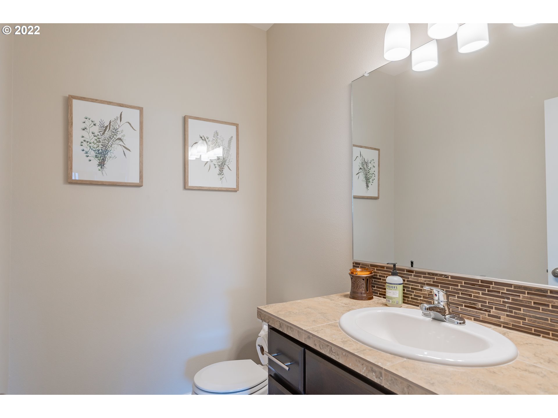 133 North 39th Court Ridgefield, WA 98642 - Photo 11 of 30 a bathroom with a sink vanity mirror and toilet