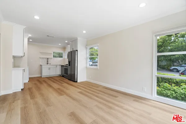 a view of an empty room with a window